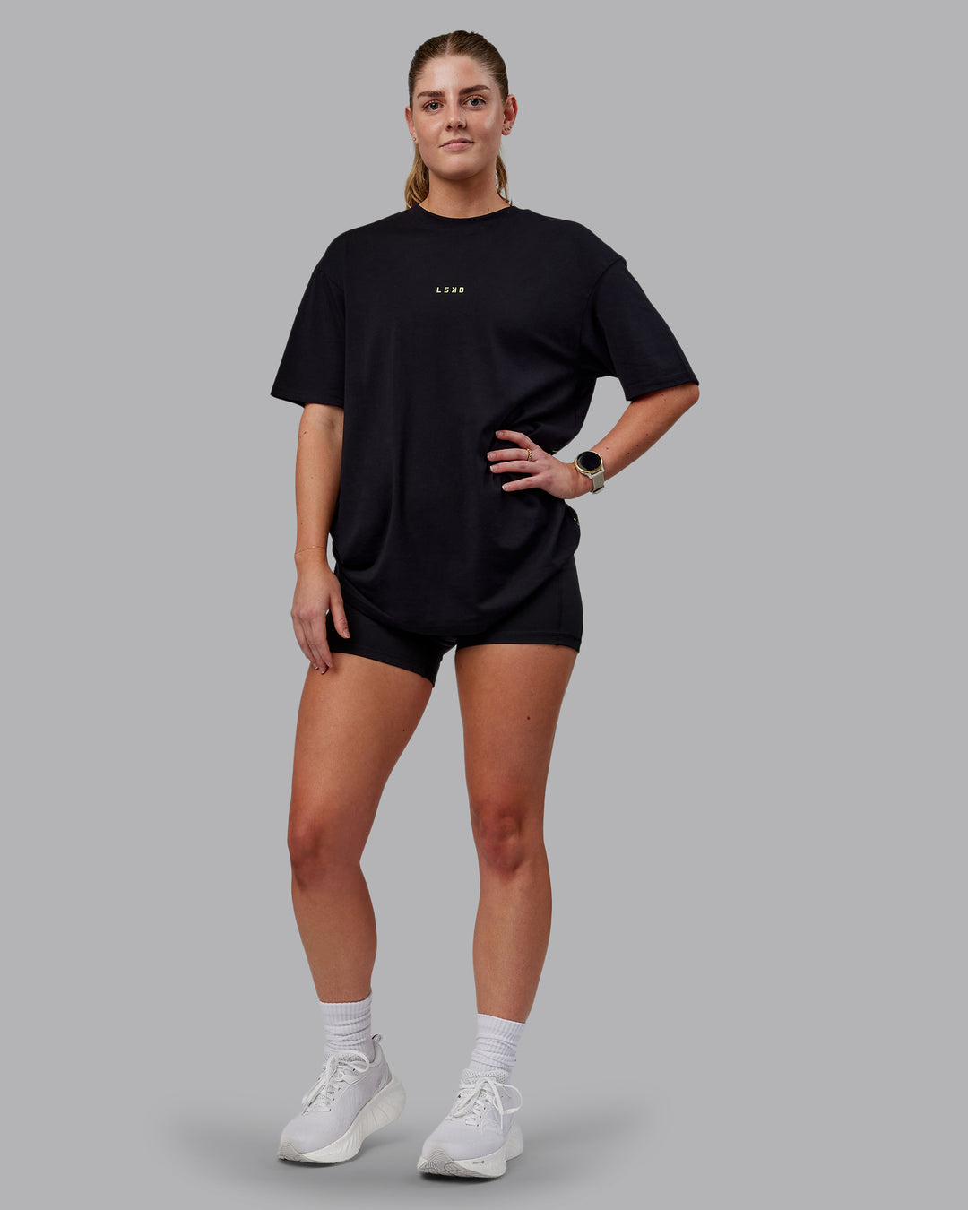 Woman wearing Unisex Leg It FLXCotton Tee Oversize - Black-Volt