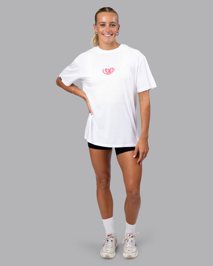 Woman wearing Unisex Love To Train FLXCotton Tee Oversize - White-Pink Lemonade | Size:XS
