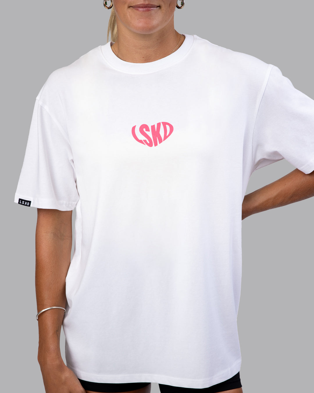 Woman wearing Unisex Love To Train FLXCotton Tee Oversize - White-Pink Lemonade | Size:XS