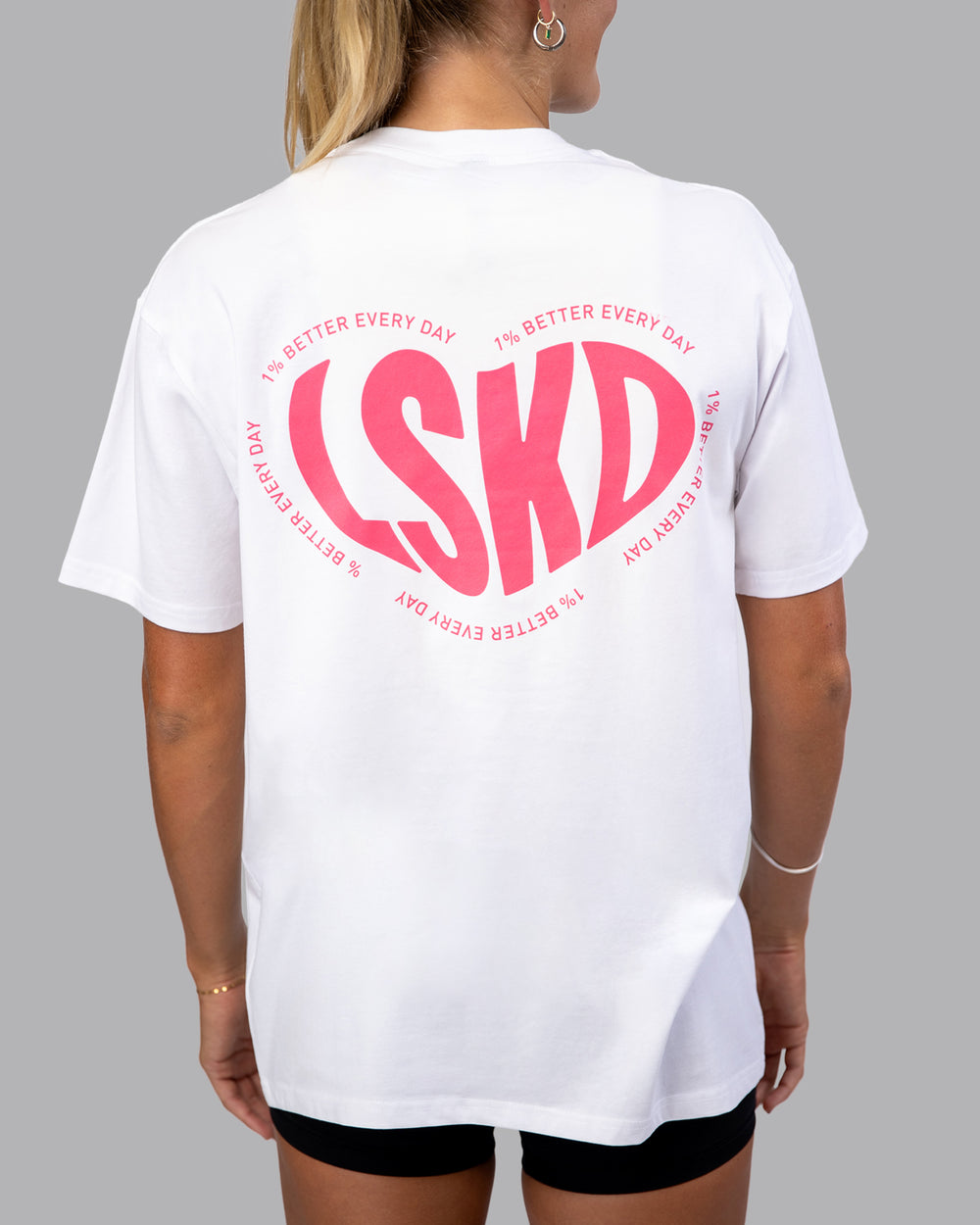 Woman wearing Unisex Love To Train FLXCotton Tee Oversize - White-Pink Lemonade | Size:XS