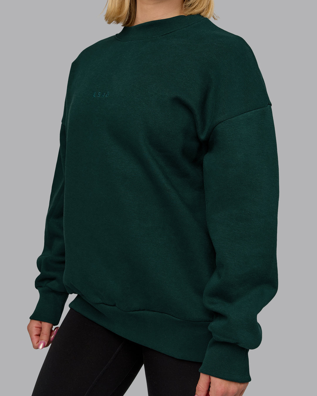 Woman wearing MVP Oversized Sweater in Dark Moss | Size:XS | Model:Halle