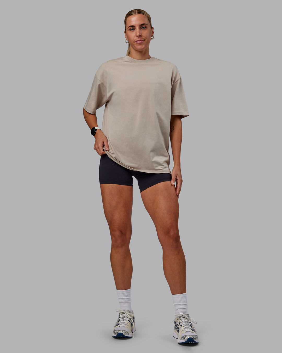 Woman wearing Unisex PimaFLX Tee Oversize in Shale Beige | Size:XS