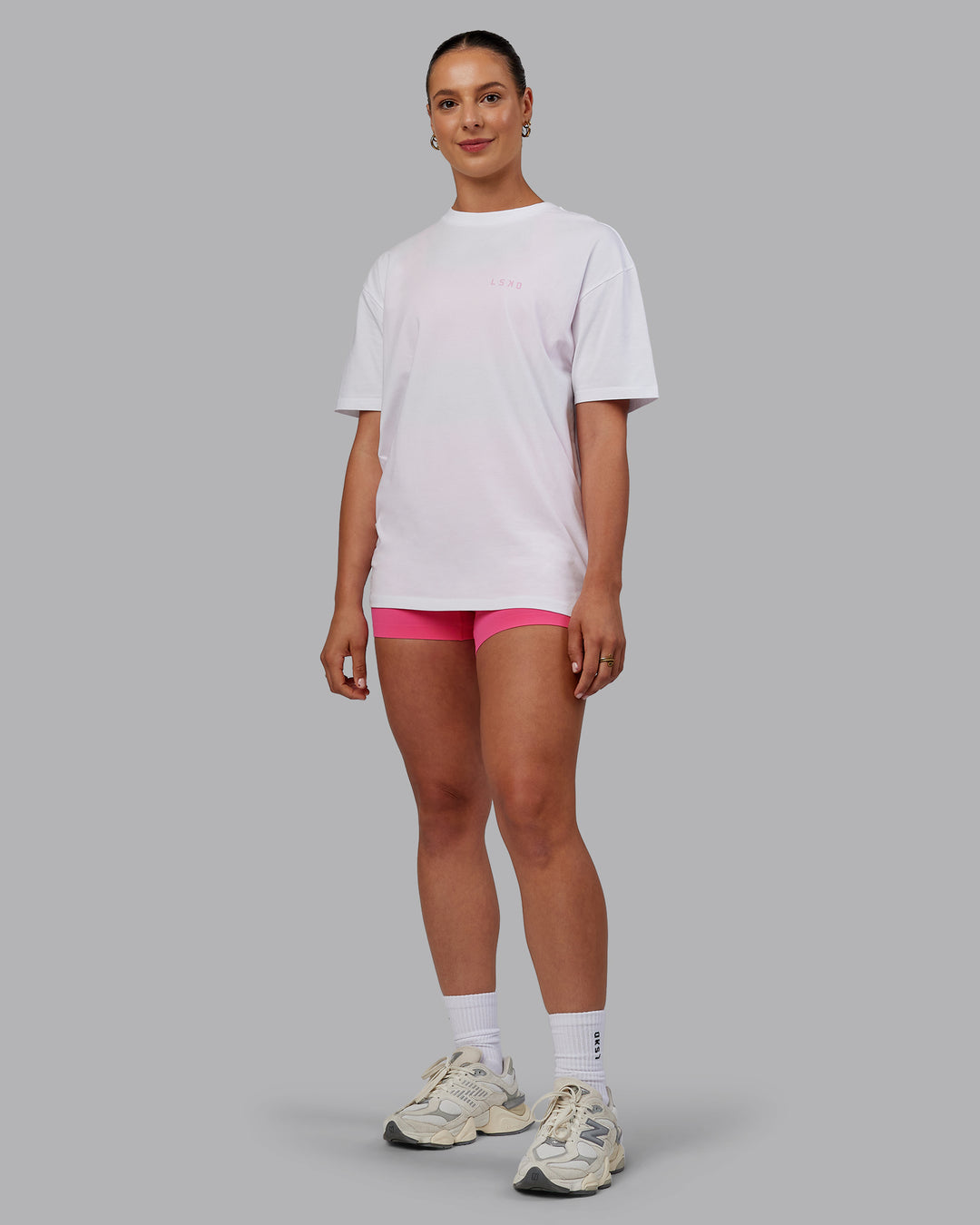 Woman wearing Unisex Strike Through FLXCotton Tee Oversize - White-Bubblegum