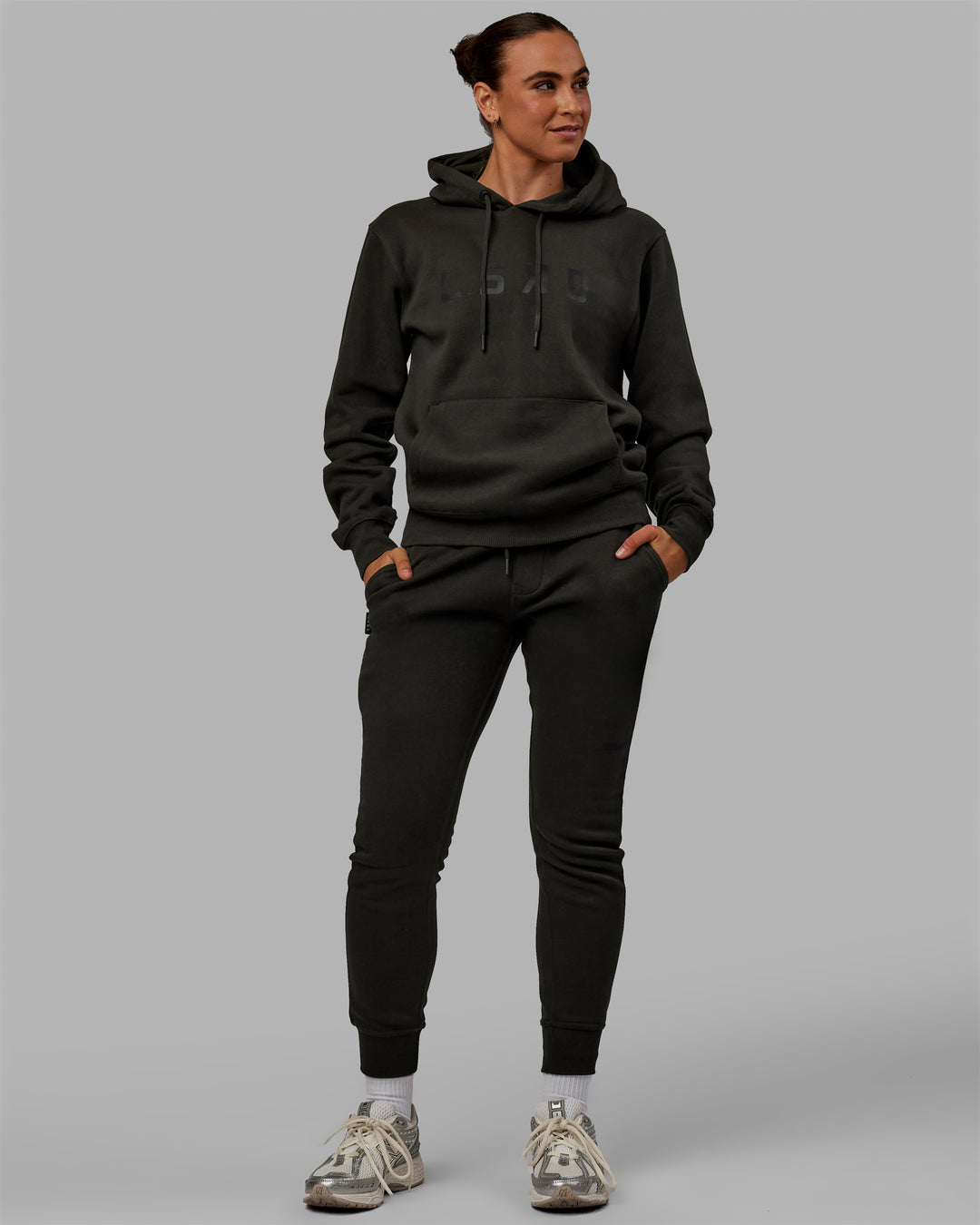 Woman wearing Unisex Structure Track Pants - Pirate Black-Black