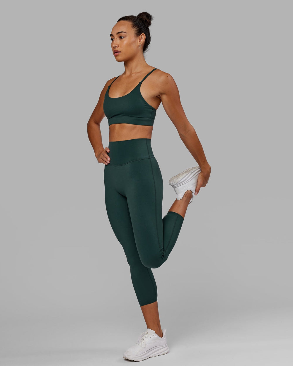 Woman wearing Elixir 7/8 Length Tight - Vital Green