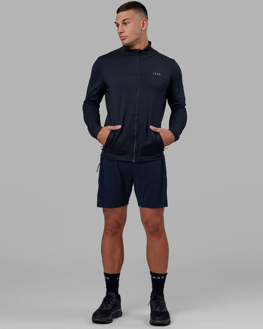 Man wearing Stride Zip Through Performance Jacket - Navy