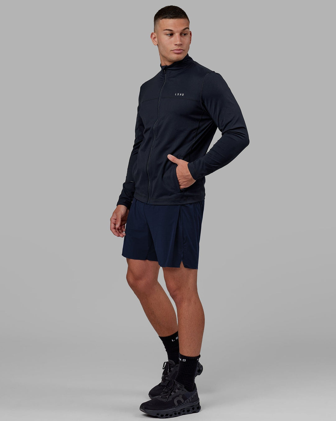 Man wearing Stride Zip Through Performance Jacket - Navy