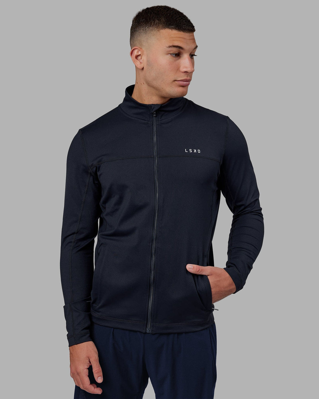 Man wearing Stride Zip Through Performance Jacket - Navy