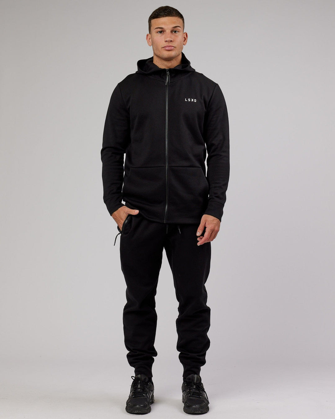 Man wearing Mens Athlete ForgedFleece Zip Up Hoodie - Black