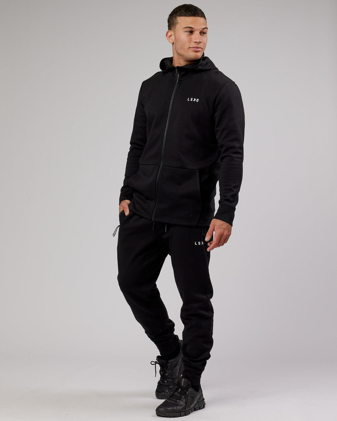 Man wearing Mens Athlete ForgedFleece Zip Up Hoodie - Black