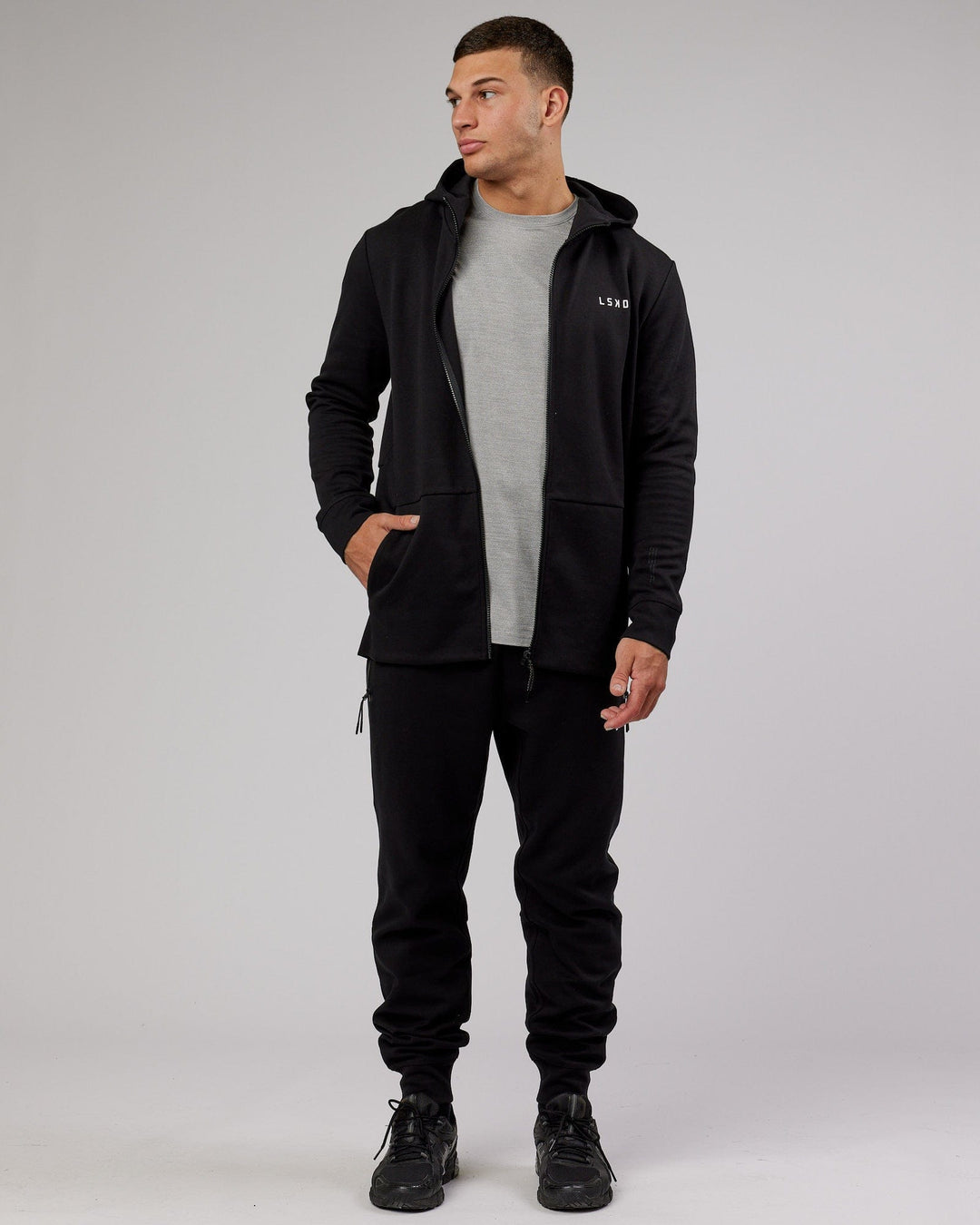 Man wearing Mens Athlete ForgedFleece Zip Up Hoodie - Black