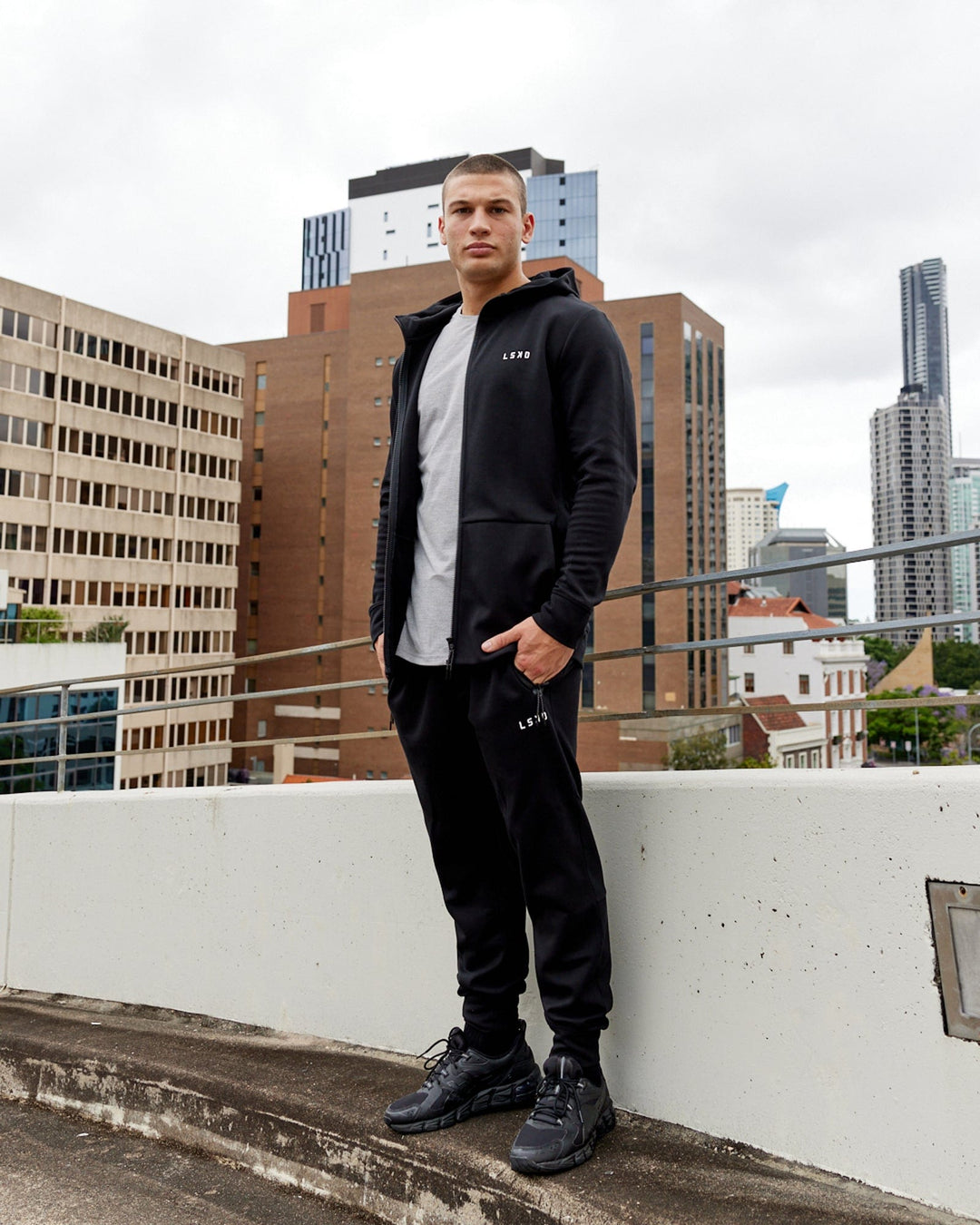 Man wearing Mens Athlete ForgedFleece Zip Up Hoodie - Black