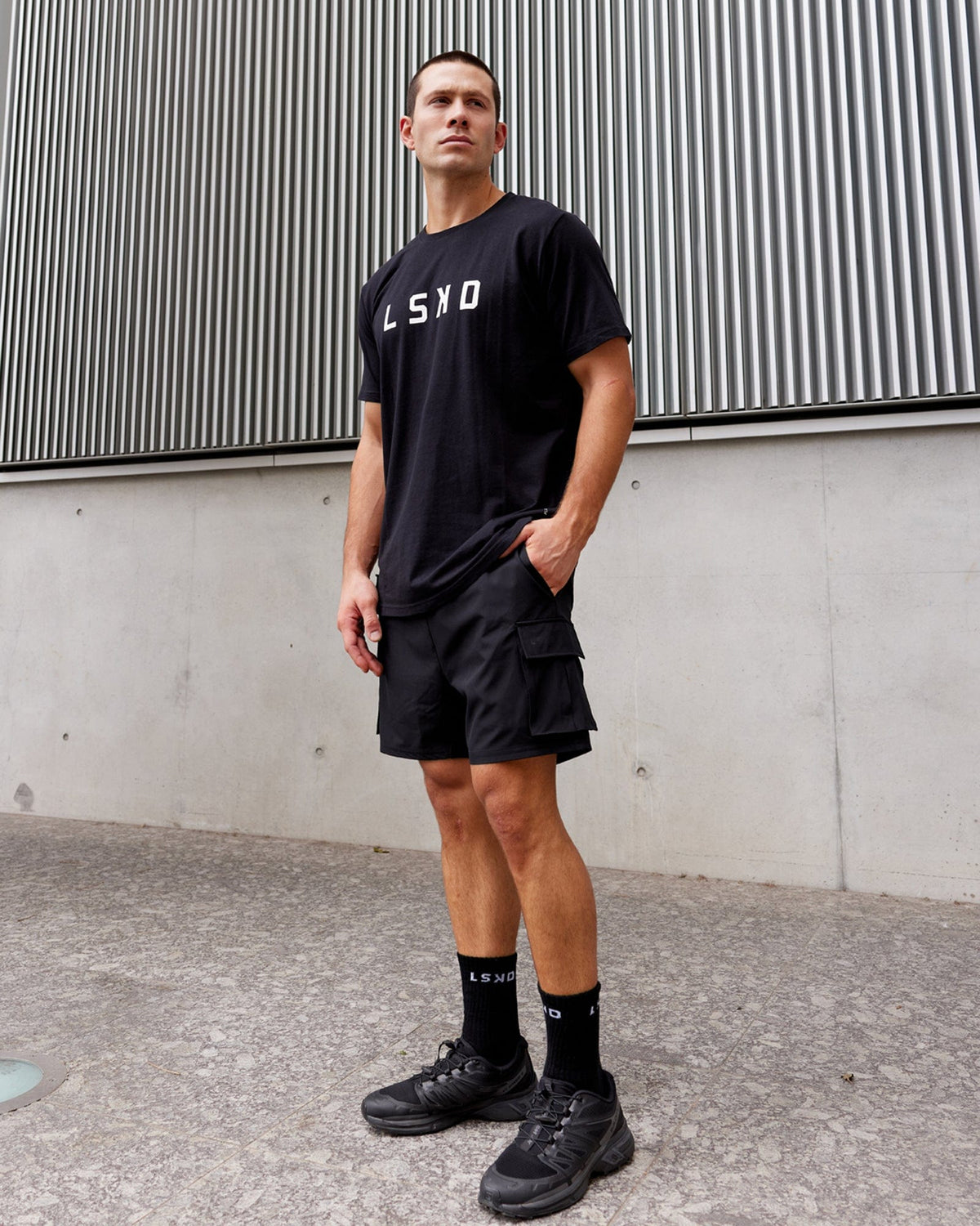 Man wearing Energy Stretch Performance Cargo Short - Black