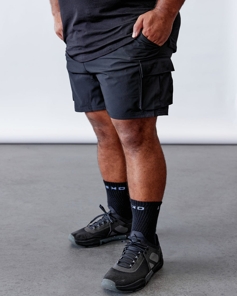 Man wearing Energy Stretch Performance Cargo Short - Black