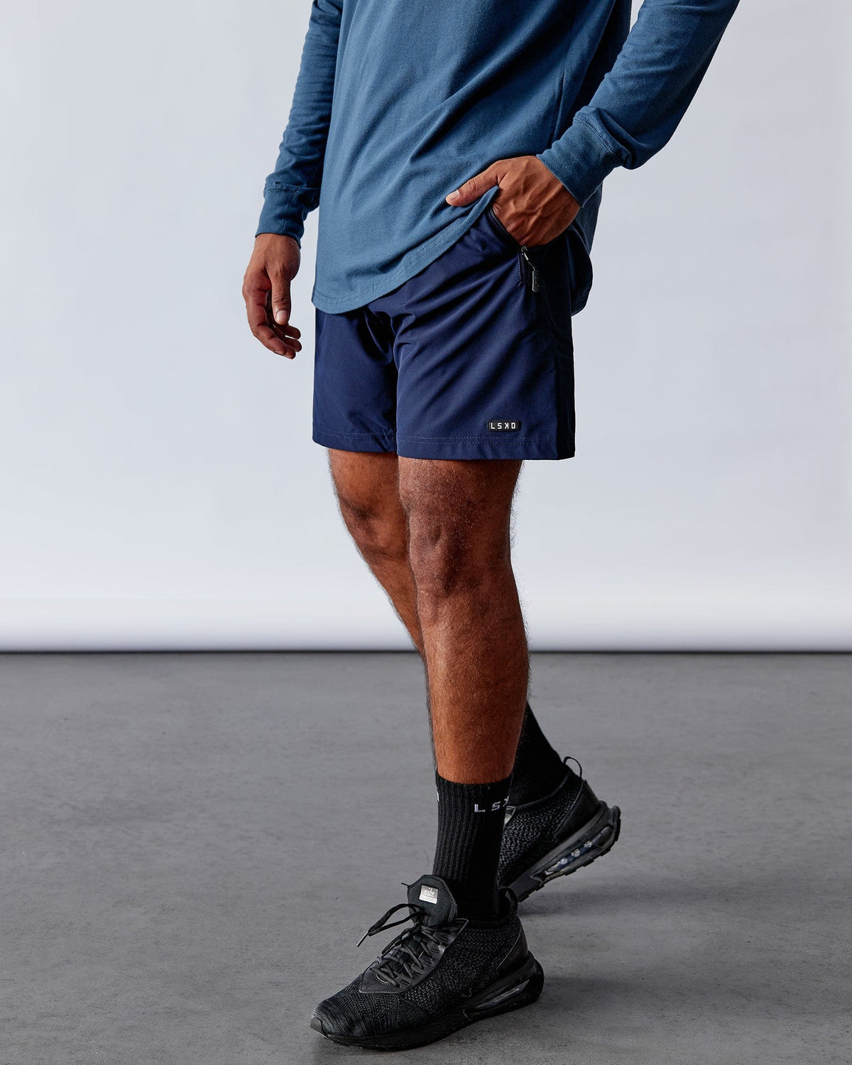 Man wearing Rep 7'' Performance Short - Navy